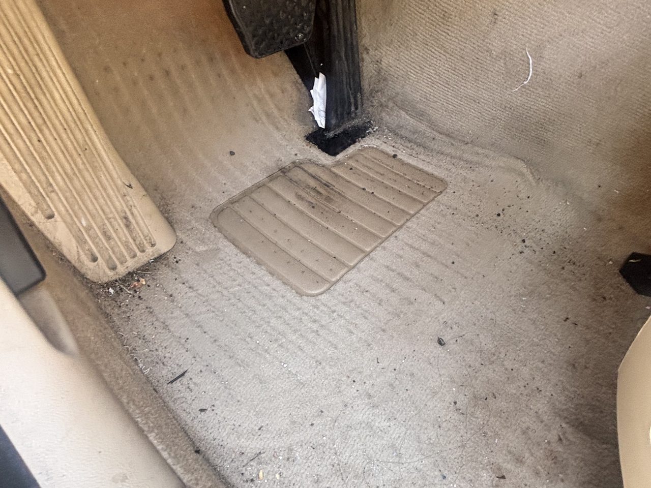 Car interior floor before detailing in North Jersey