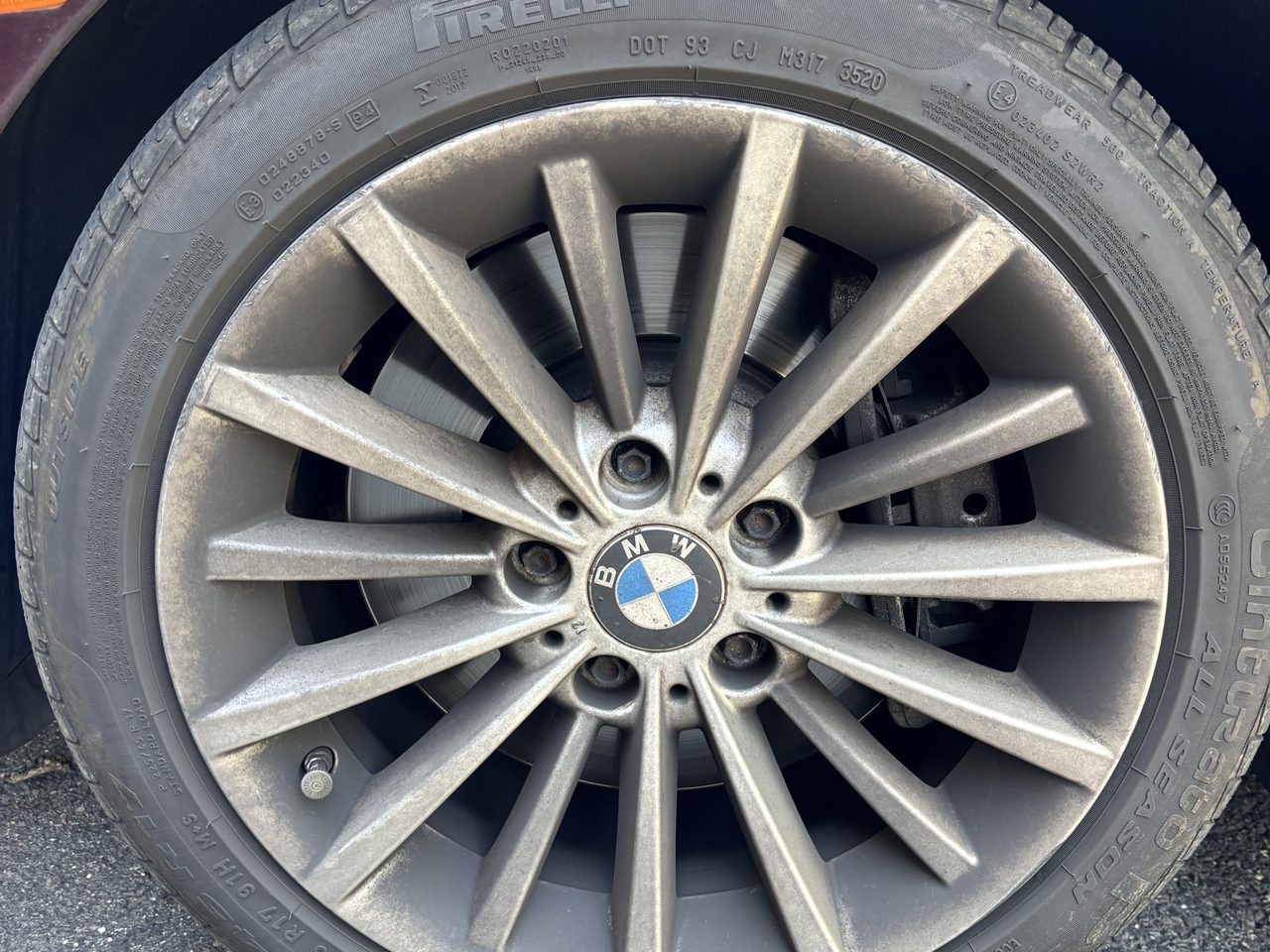 Car wheel and tire before detailing in North Jersey