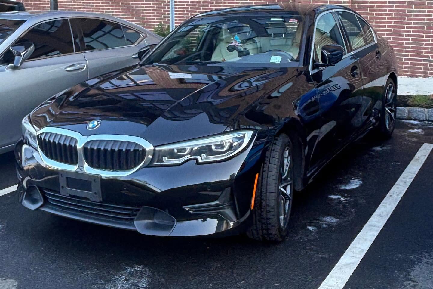 Professional detailer polishing a car at your location in North Jersey