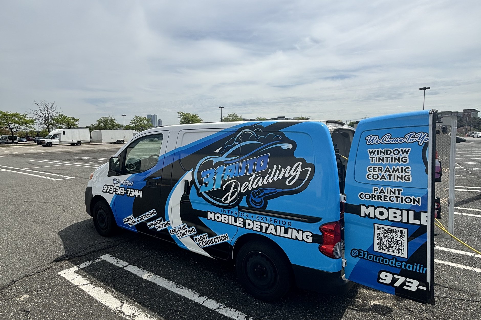 Professional detailer polishing a car at your location in Bergen County