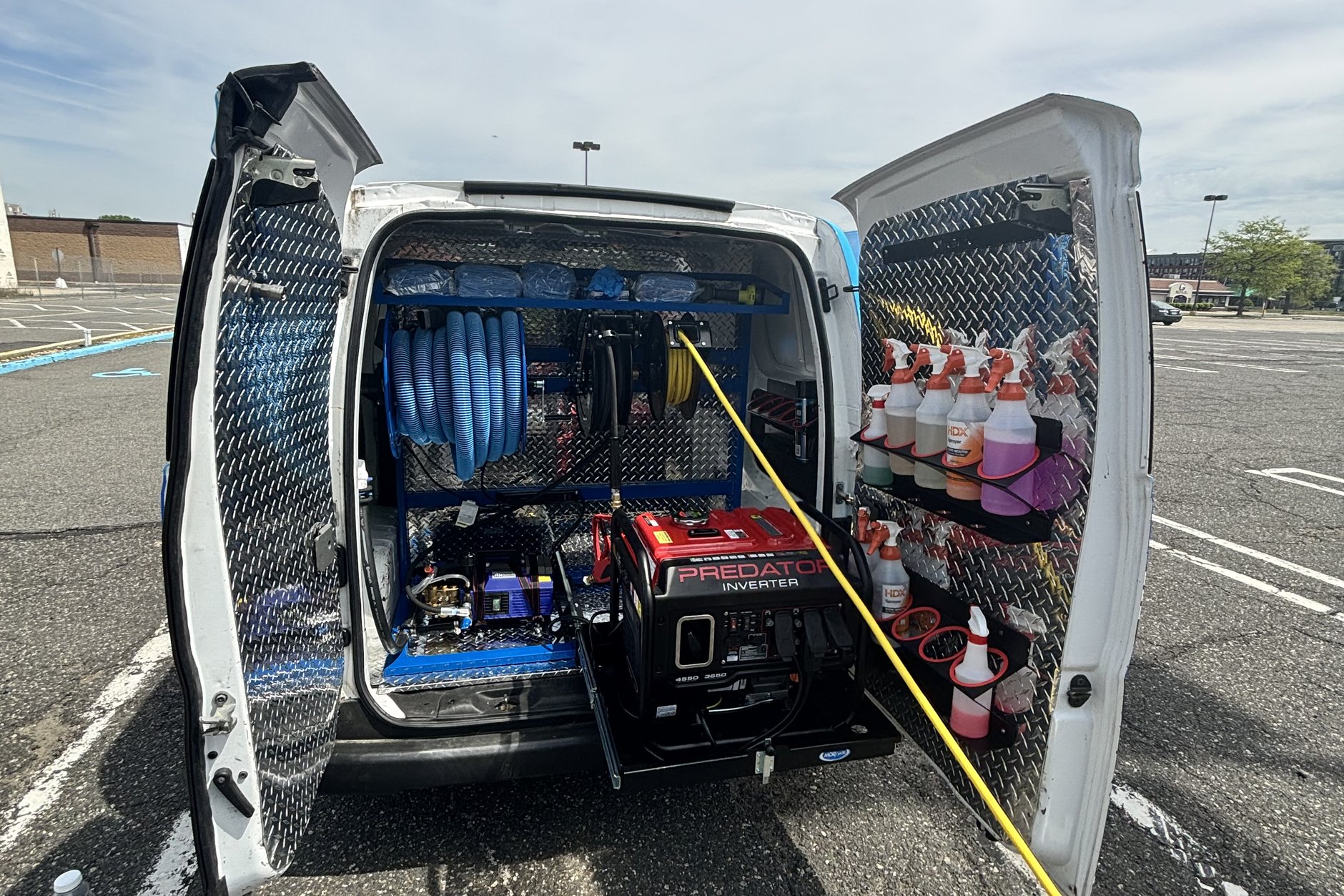 Professional detailer polishing a car at your location in Essex County