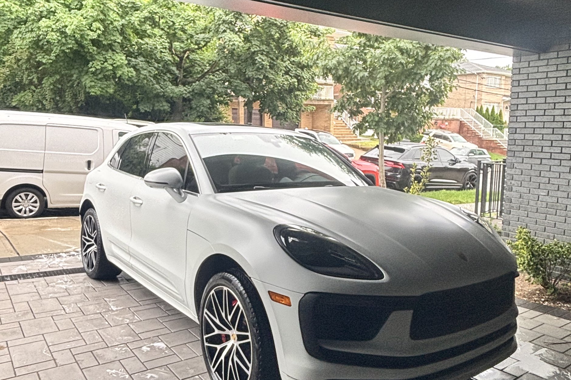 Professional detailer polishing a car at your location in Morris County