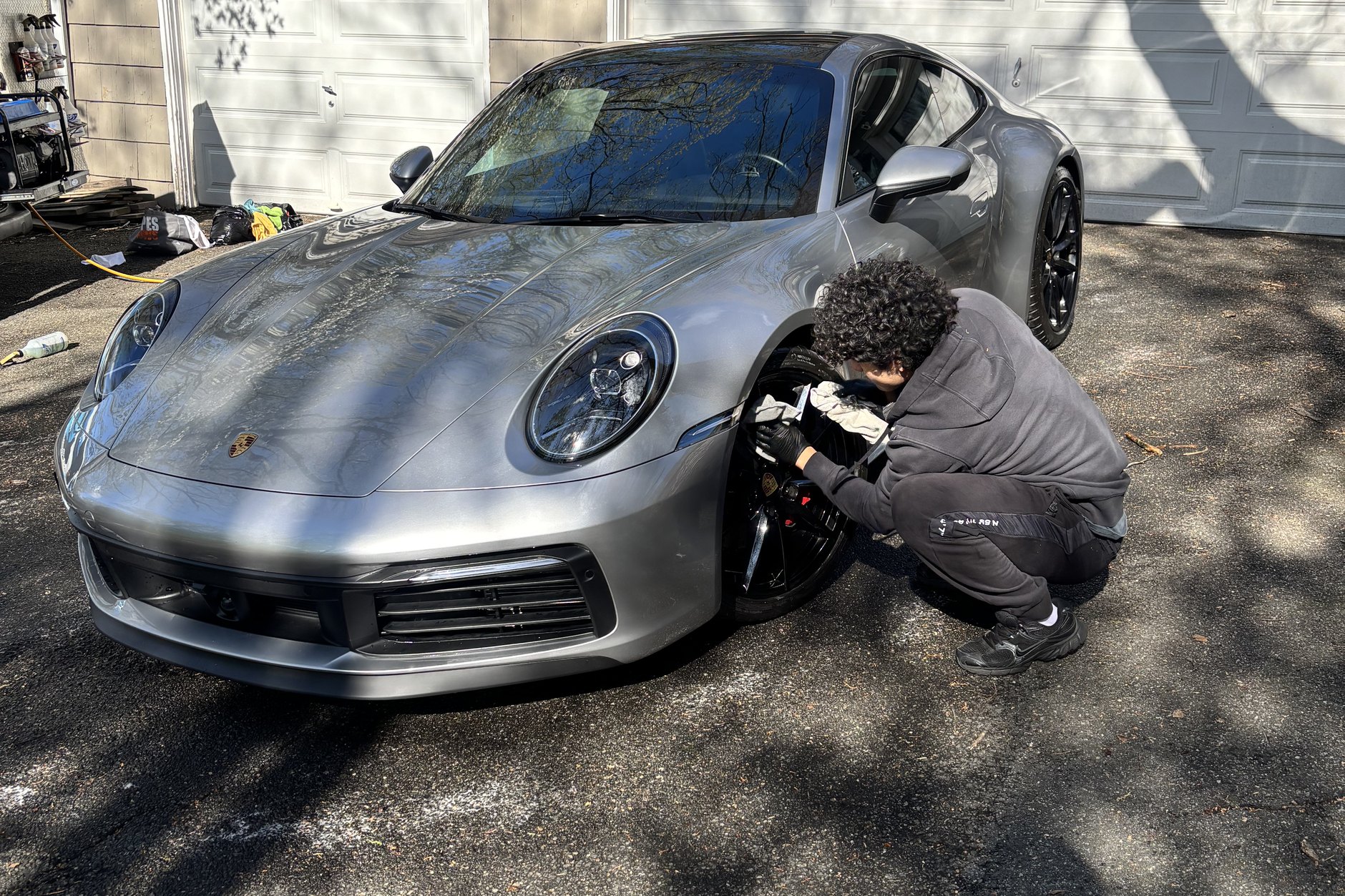 Professional detailer polishing a car at your location in Passaic County